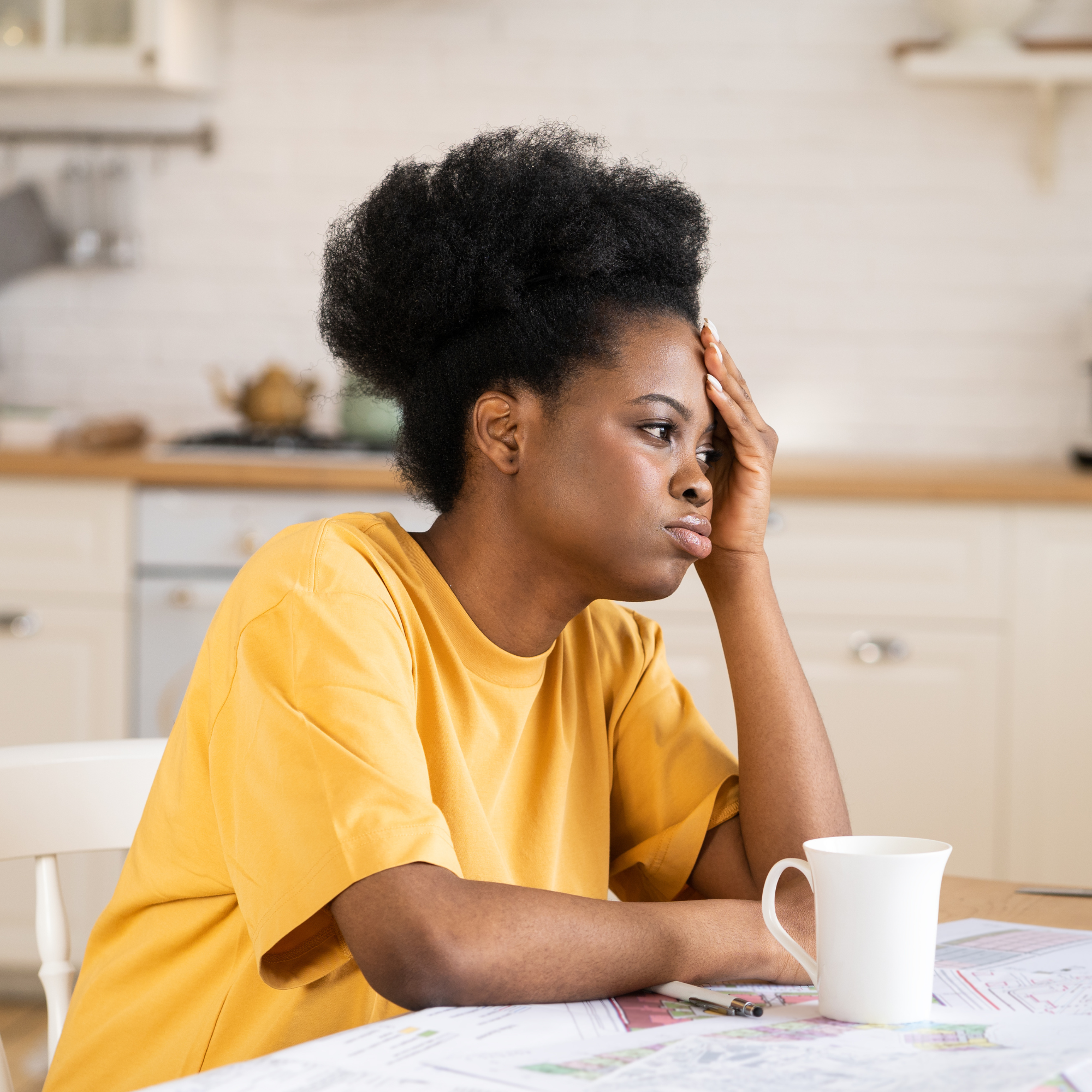 Overwhelmed teacher at table